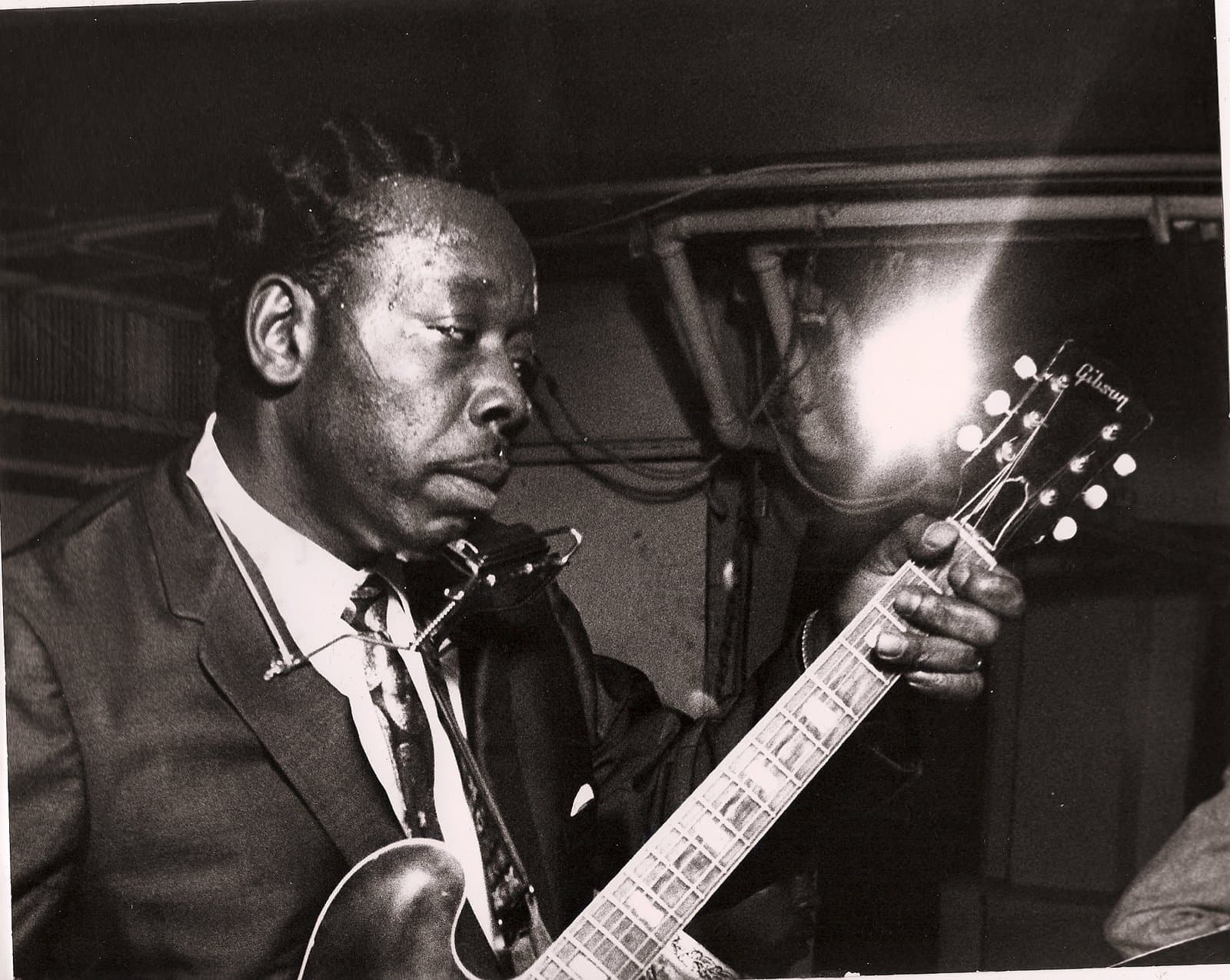Slim Harpo performing with guitar